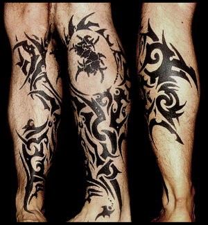 Покажите красивую татуировку на ноге?
